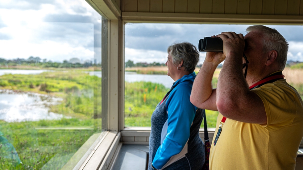 Couple birdwatching at WWT site